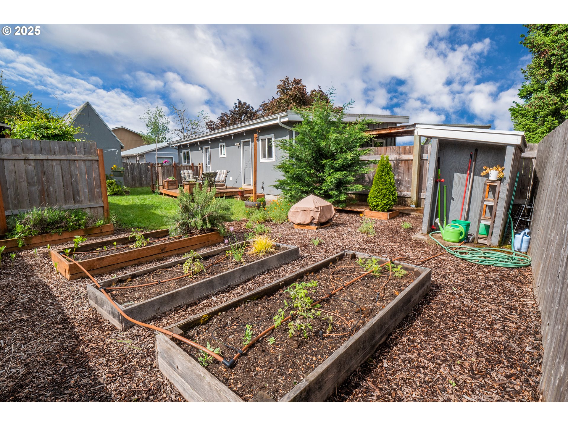2111 South Bertelsen Road Eugene, OR 97405 - Photo 27 of 32 a view of a backyard with sitting area