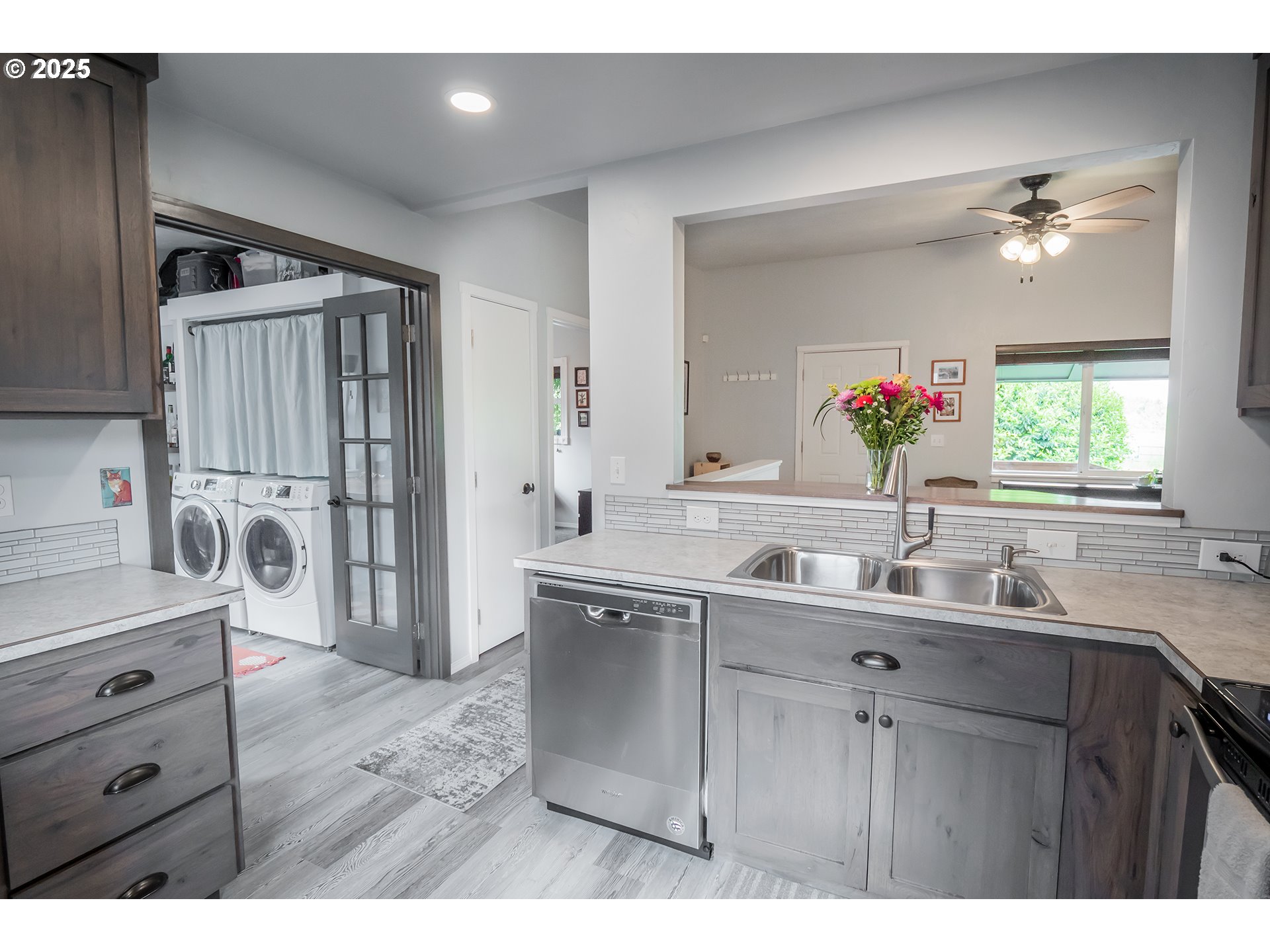 2111 South Bertelsen Road Eugene, OR 97405 - Photo 8 of 32 a kitchen with a sink appliances and a window