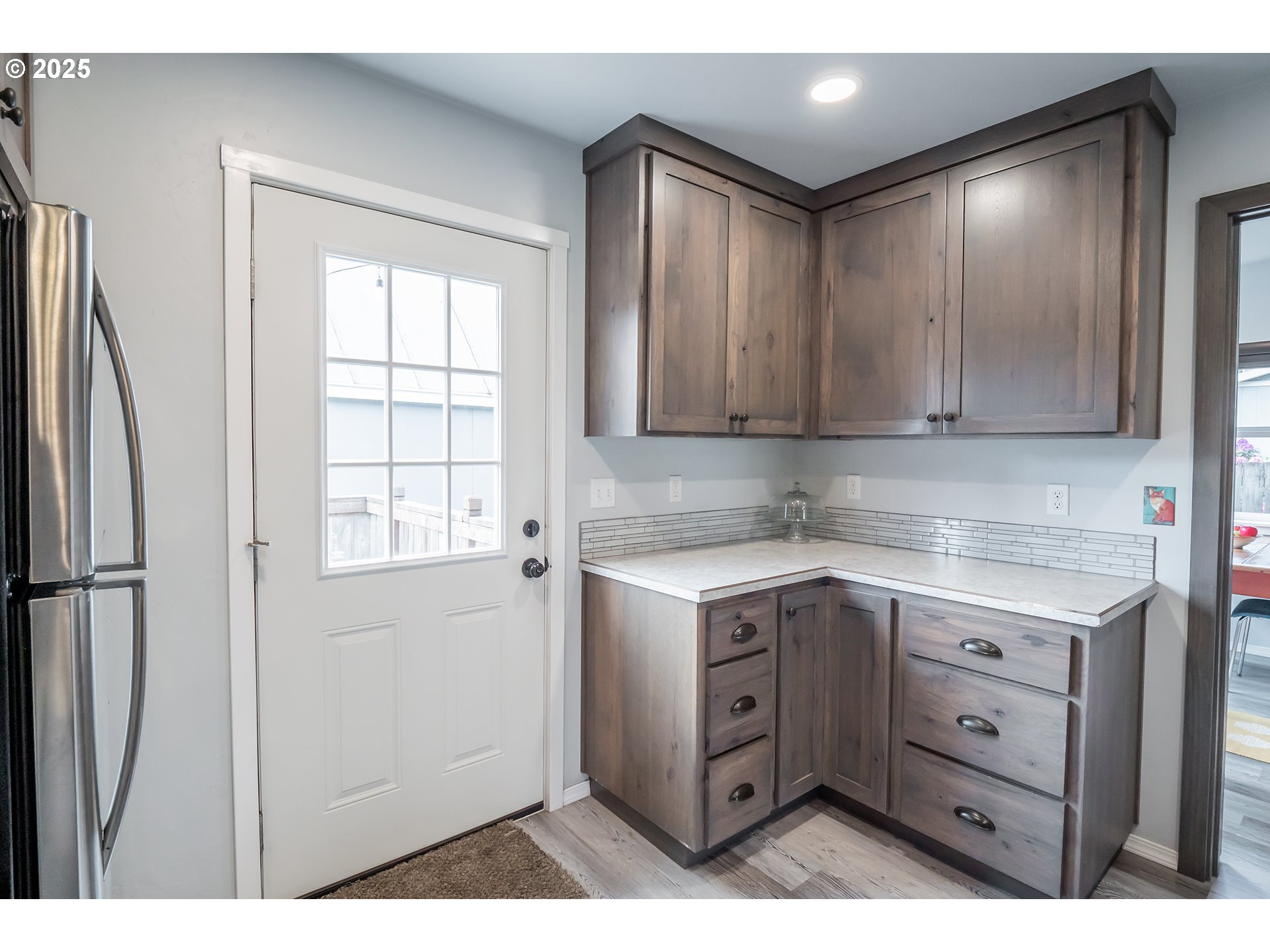 2111 South Bertelsen Road Eugene, OR 97405 - Photo 9 of 32 a kitchen with a stove a sink and a window