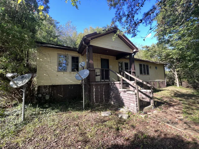 a front view of a house with yard