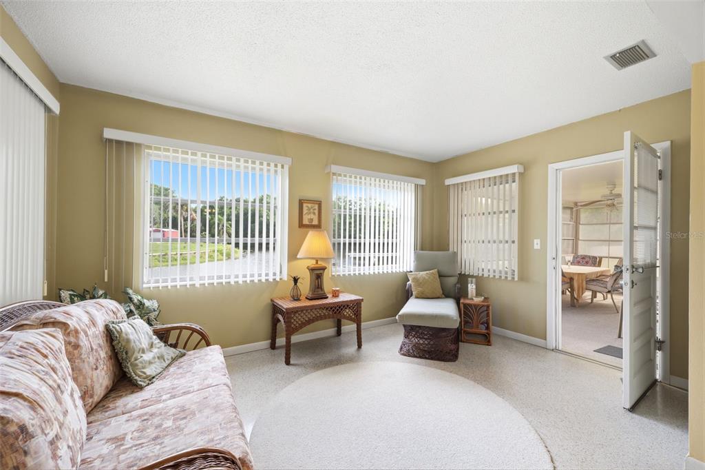 1830 South Mandarin Terrace Inverness, FL 34450 - Photo 3 of 47 a bedroom with furniture and large windows