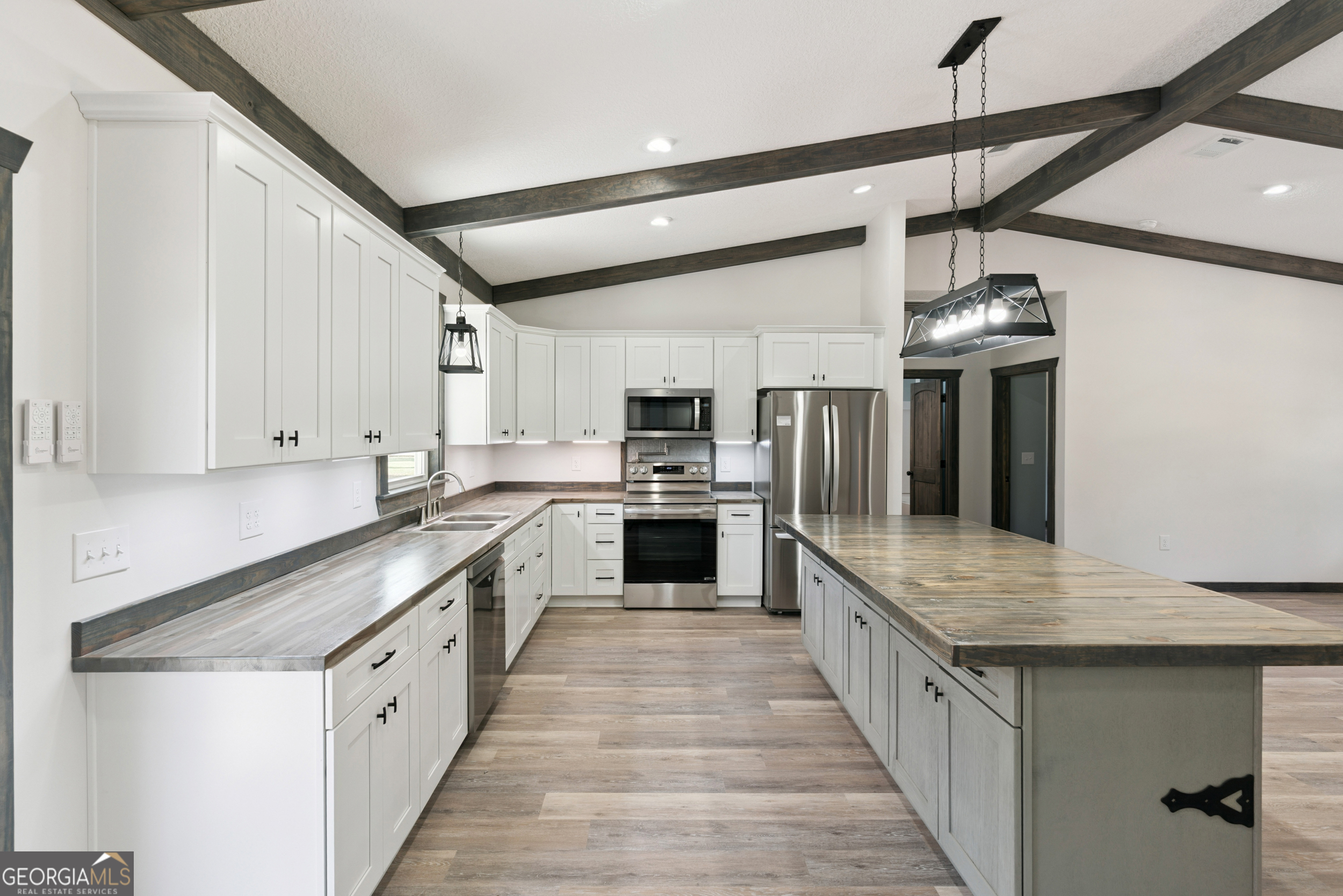 29 Chisholm Street Nahunta, GA 31553 - Photo 11 of 49 a large kitchen with a stove and a sink