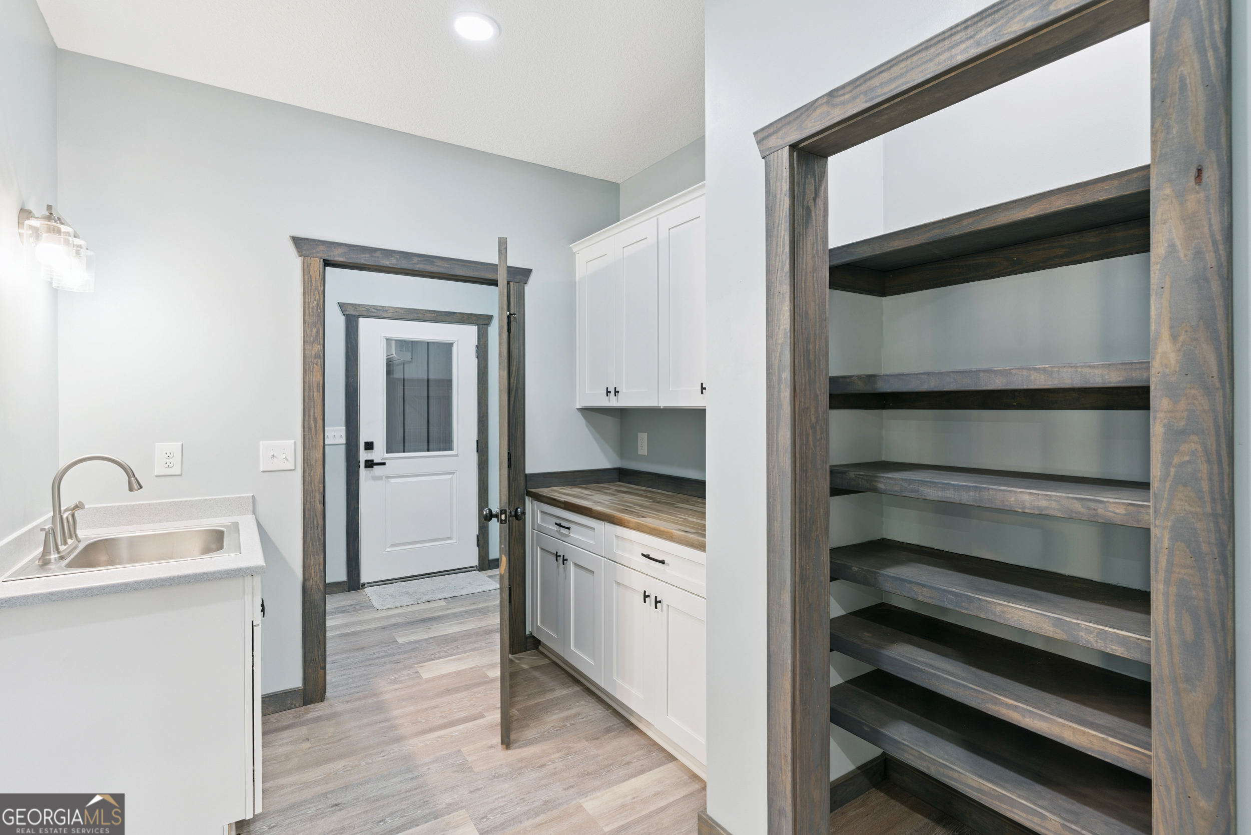 29 Chisholm Street Nahunta, GA 31553 - Photo 15 of 49 a kitchen with a sink and a refrigerator