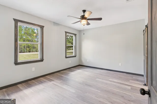 a view of an empty room with a window