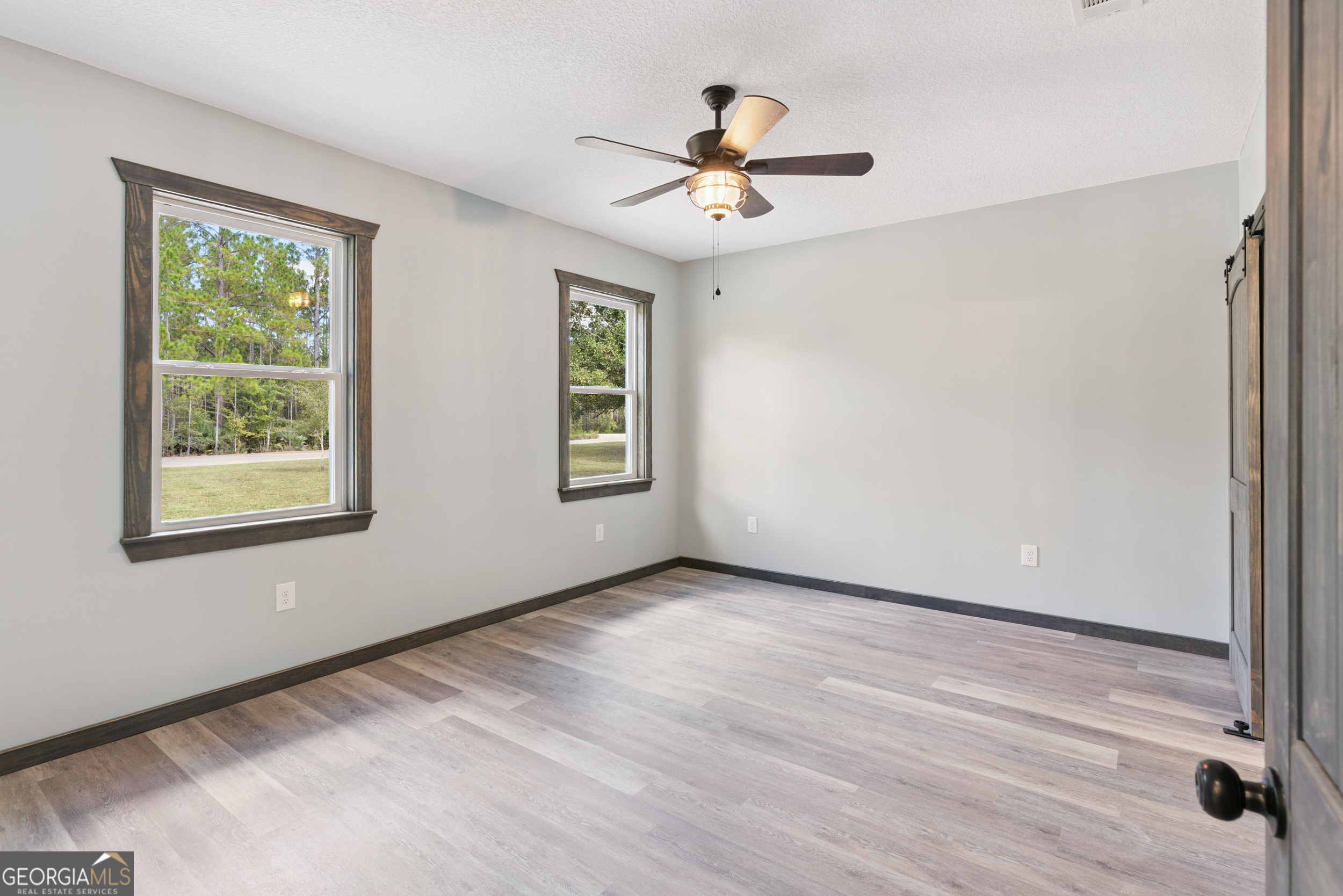 29 Chisholm Street Nahunta, GA 31553 - Photo 24 of 49 a view of an empty room with a window
