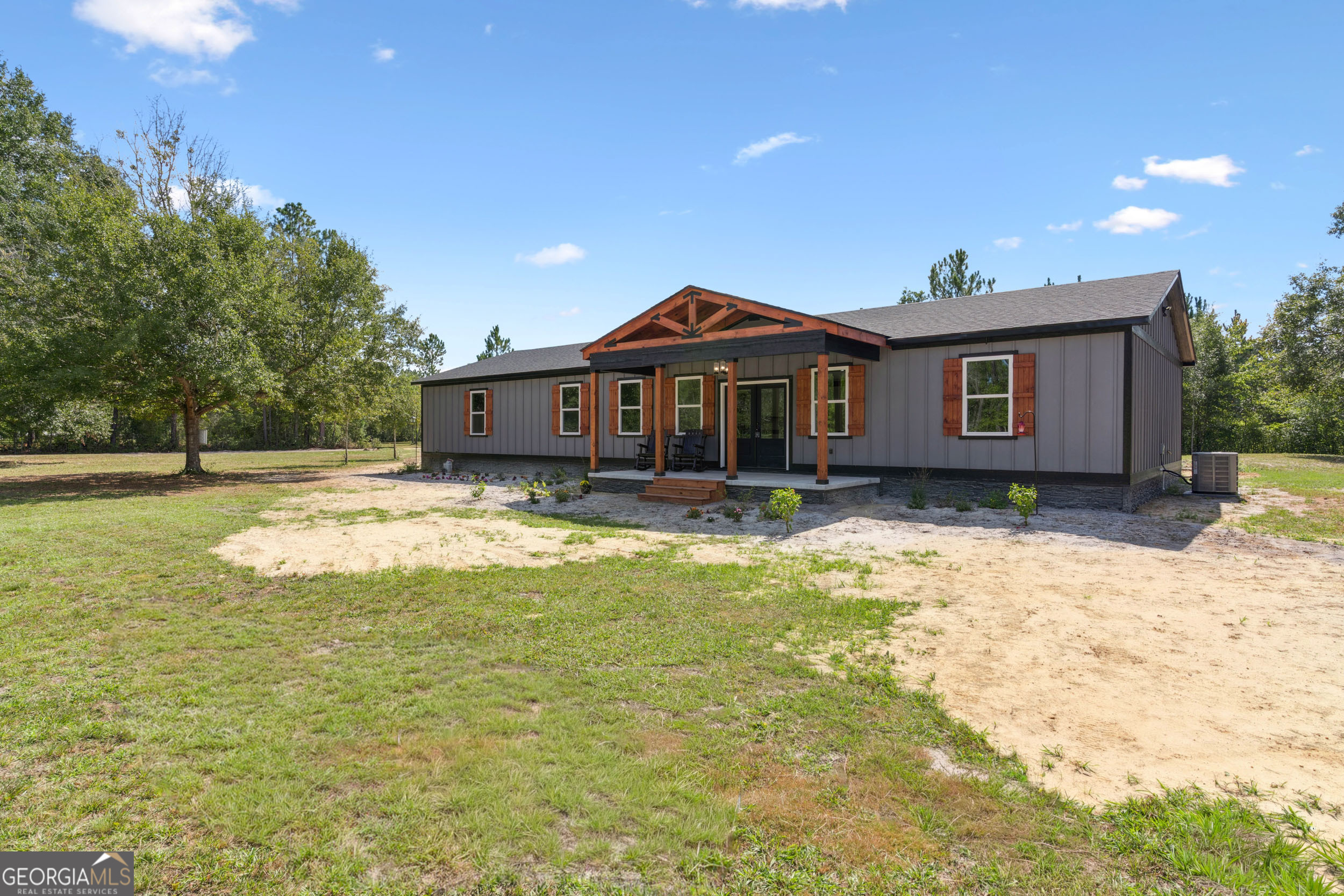 29 Chisholm Street Nahunta, GA 31553 - Photo 34 of 49 a front view of a house with a yard