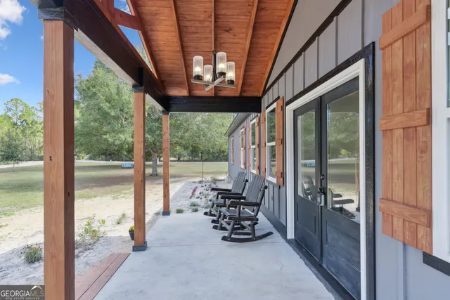 a view of living room with furniture and garden view