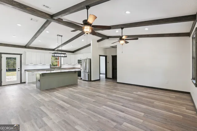 a view of a kitchen with a dishwasher and a refrigerator