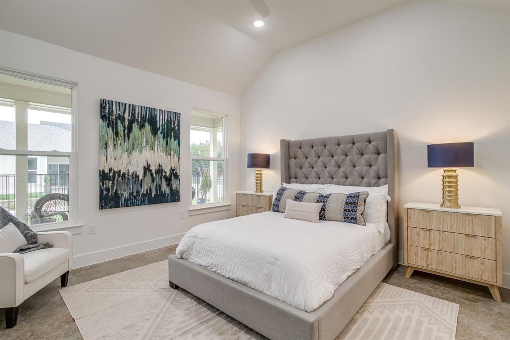 102 Cardinal Wds Granbury, TX 76049 - Photo 17 of 26 a bedroom with a large bed couch and a window