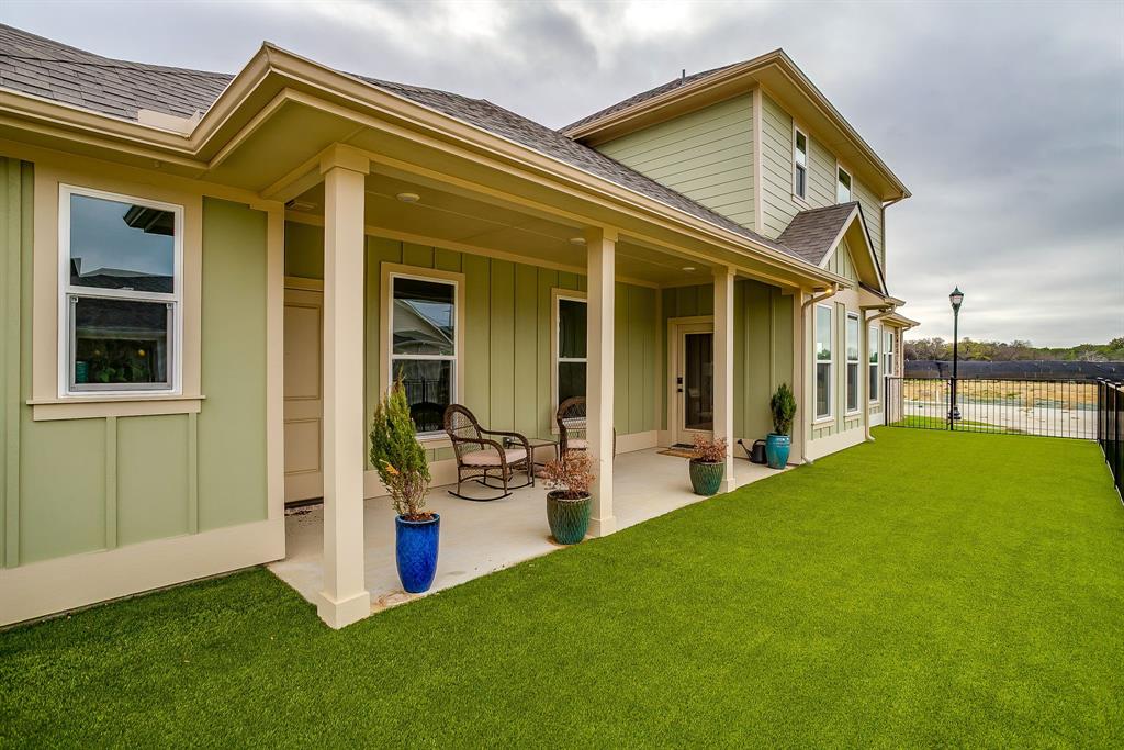 102 Cardinal Wds Granbury, TX 76049 - Photo 24 of 26 a view of a house with sitting area and garden