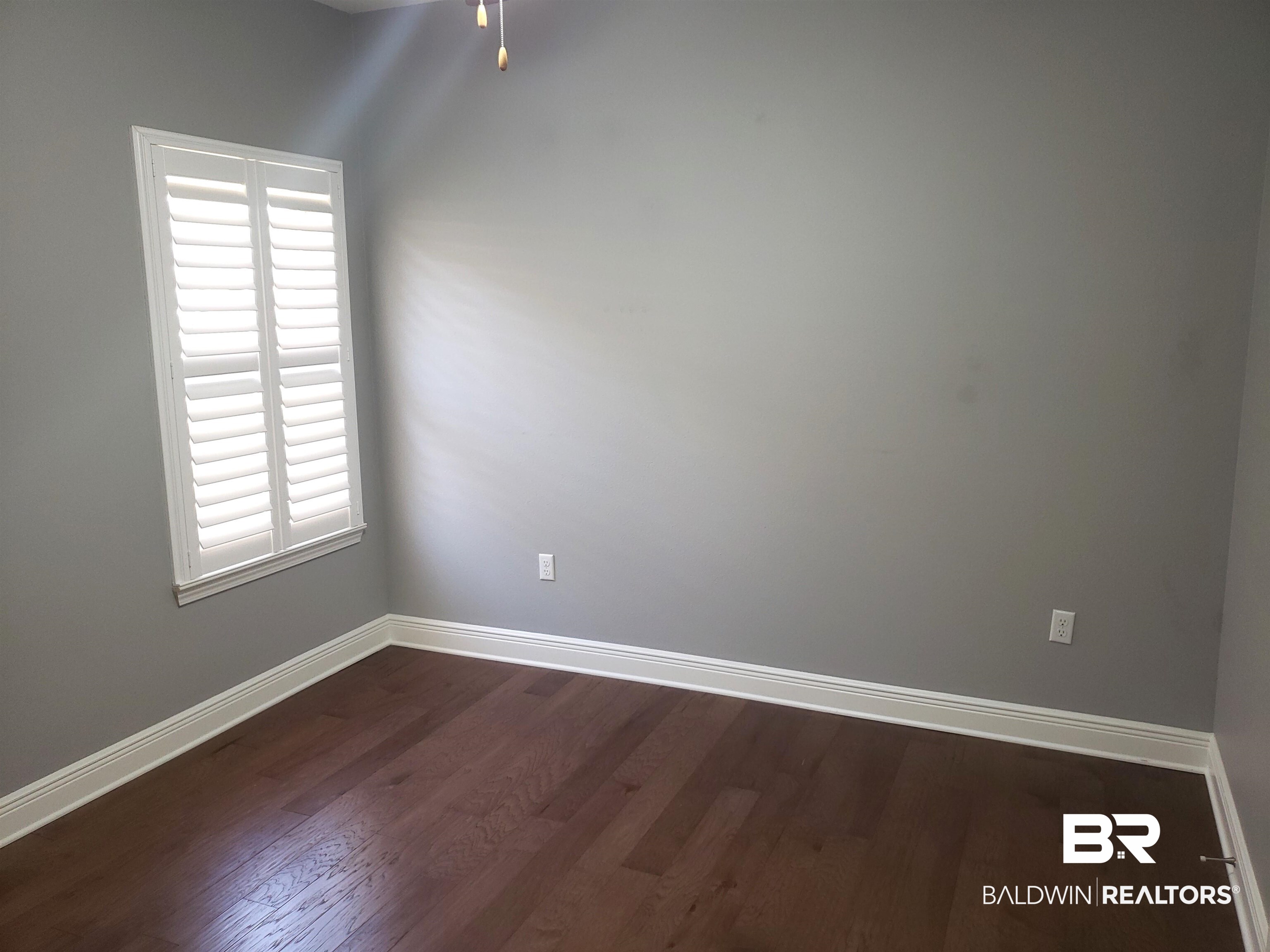 23373 Dundee Circle Foley, AL 36535 - Photo 20 of 34 Bedroom 3 featuring hardwood flooring & custom shutters
