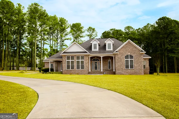a front view of a house with a yard