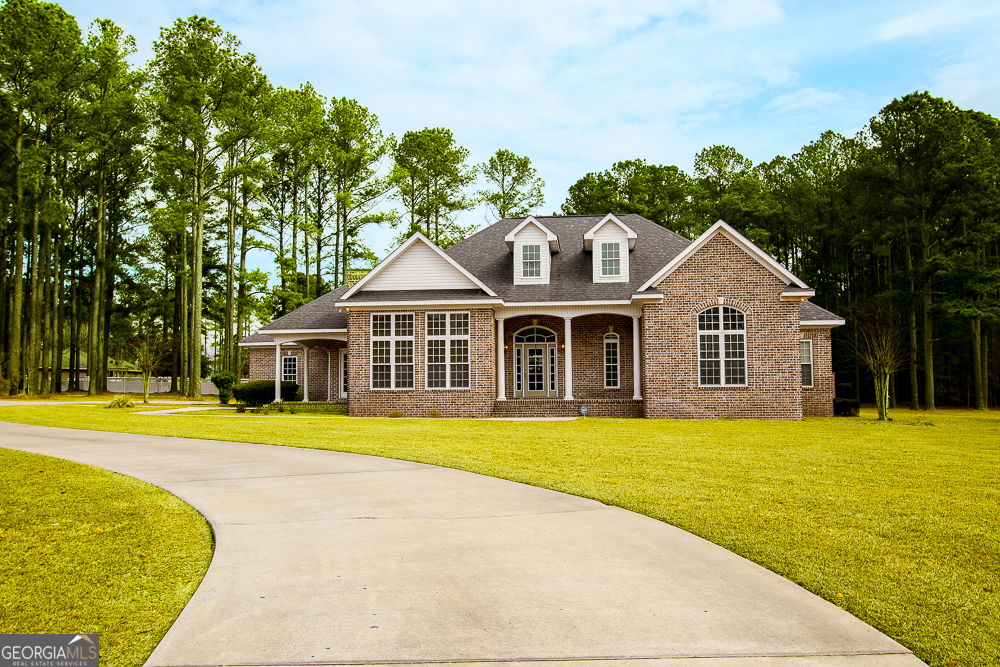 200 Lex Strickland Road Claxton, GA 30417 - Photo 1 of 1 a front view of a house with a yard
