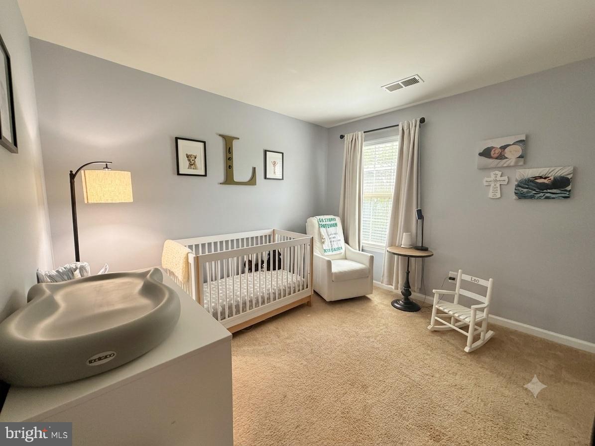 17875 Sugarberry Road Dumfries, VA 22026 - Photo 17 of 30 a bedroom with furniture and a window
