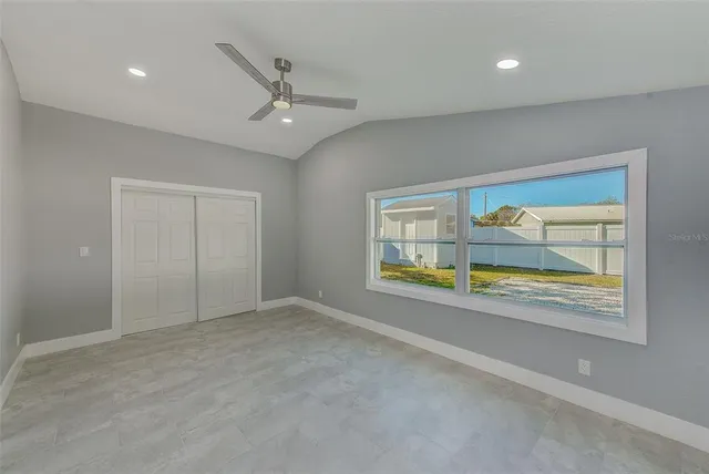 an aerial view of a house with a swimming pool yard and outdoor seating