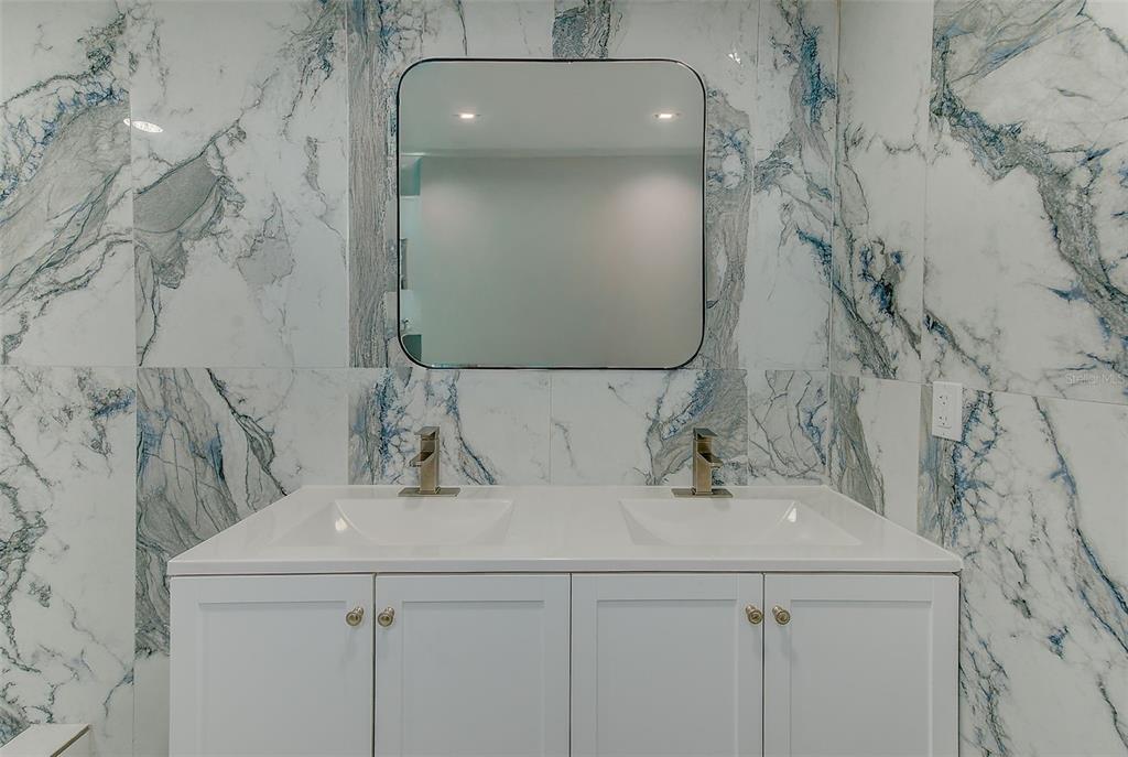 6208 Florida Circle East Apollo Beach, FL 33572 - Photo 19 of 43 a bathroom with a sink and mirror