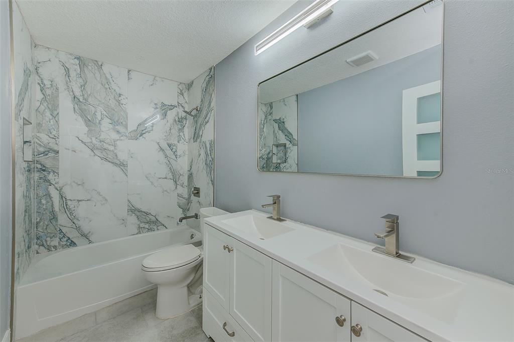 6208 Florida Circle East Apollo Beach, FL 33572 - Photo 24 of 43 a bathroom with a sink toilet and shower