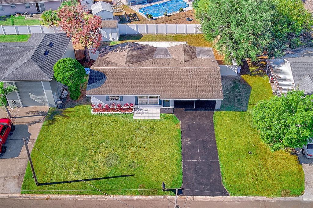 6208 Florida Circle East Apollo Beach, FL 33572 - Photo 37 of 43 a aerial view of a house with swimming pool and large trees