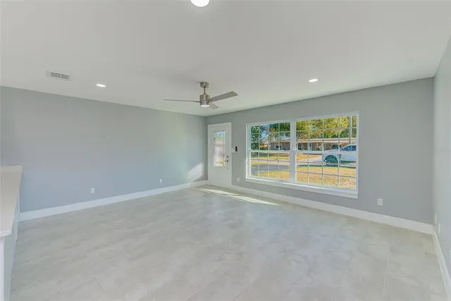 a view of an empty room with a window