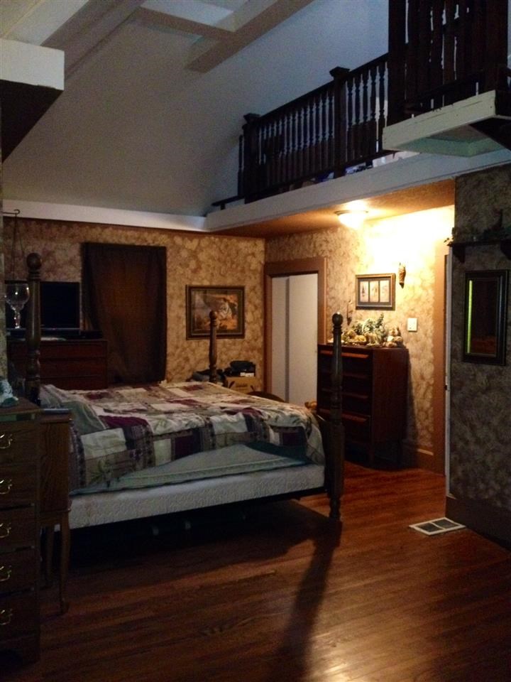 6838 North Bellview Road Freeport, IL 61032 - Photo 6 of 22 a bedroom with furniture and a flat screen tv