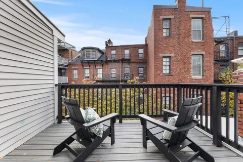 a view of a brick building from a balcony