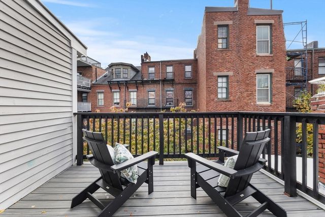 a view of a brick building from a balcony