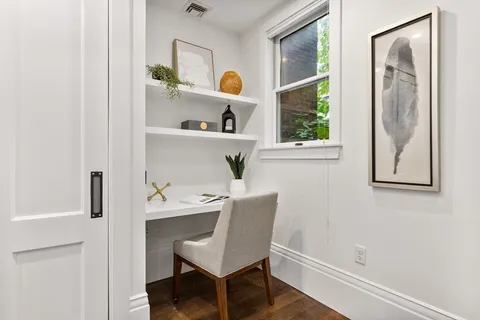 a workspace with furniture and a window