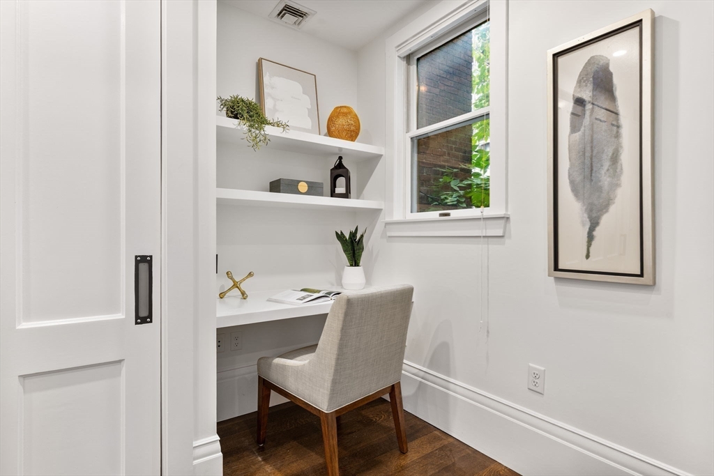 9 Bond Street Boston, MA 02118 - Photo 6 of 21 a workspace with furniture and a window