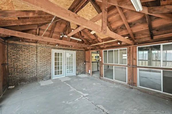a view of a room with wooden walls