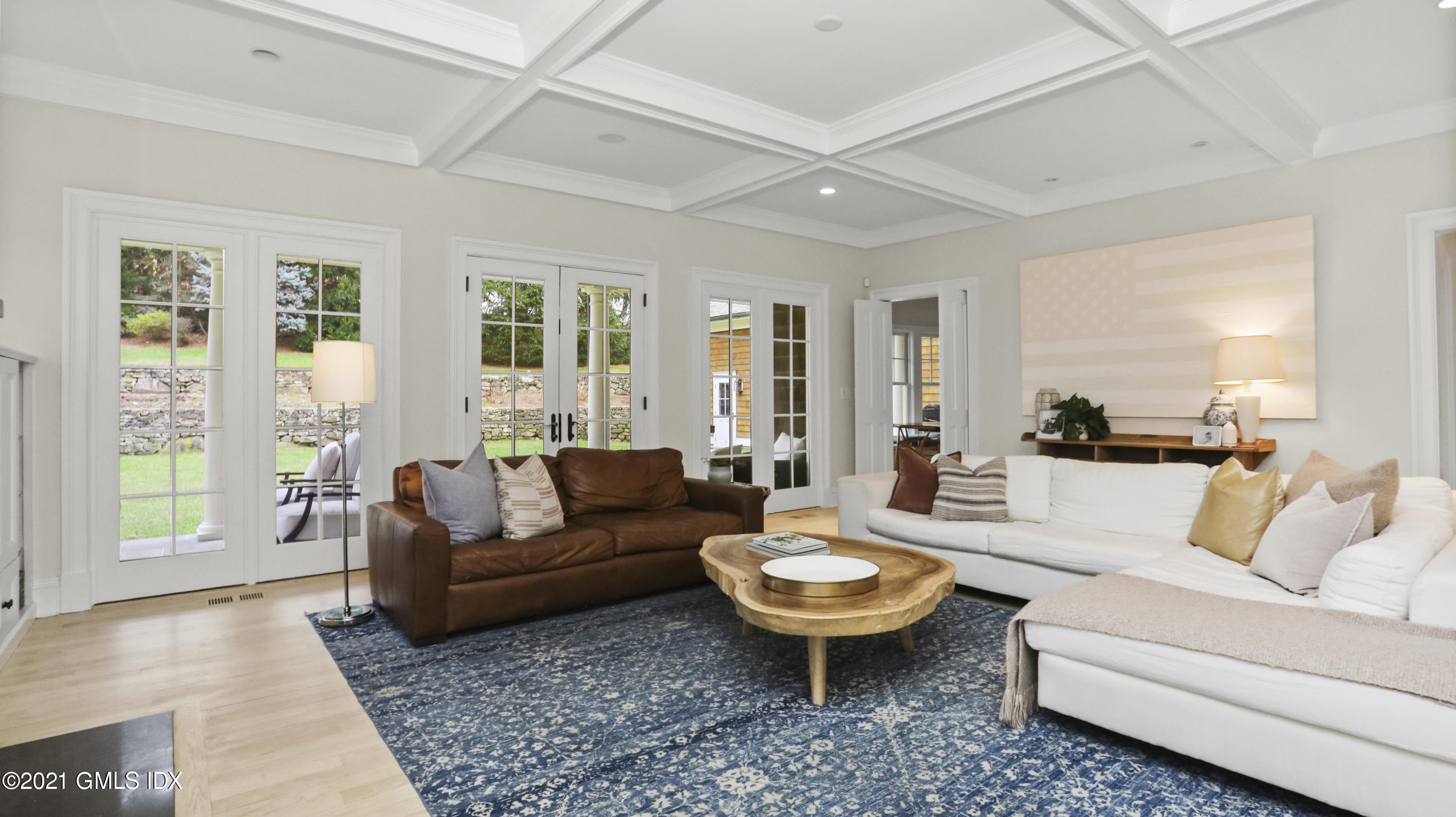 44 Glen Avon Drive Riverside, CT 06878 - Photo 12 of 39 a living room with furniture a table and a large window