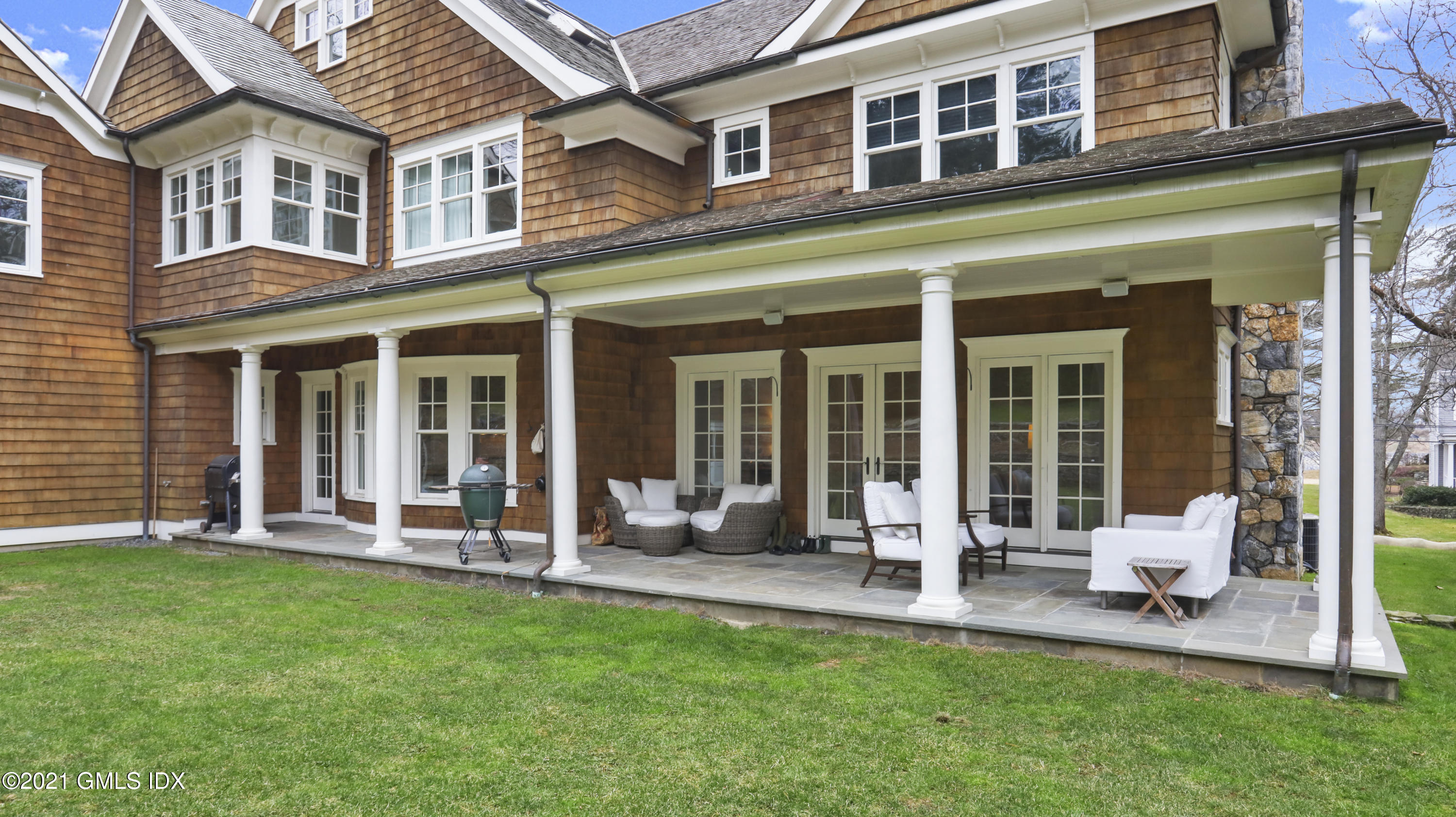 44 Glen Avon Drive Riverside, CT 06878 - Photo 29 of 39 front view of a brick building with a yard