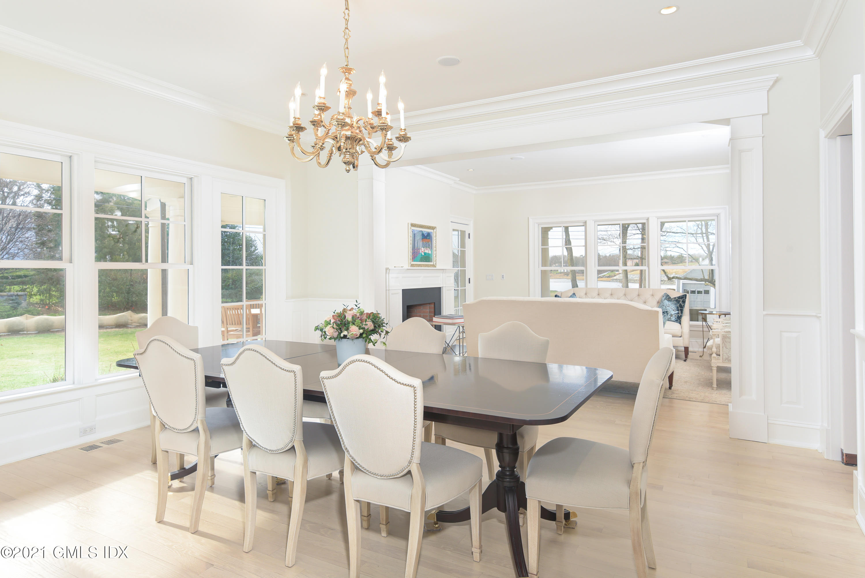 44 Glen Avon Drive Riverside, CT 06878 - Photo 7 of 39 a view of a dining room with furniture a chandelier and wooden floor