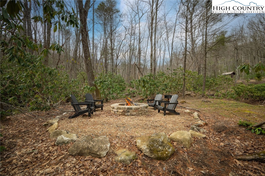 Lot 150 Angel Fire Trail Dobson, NC 27017 - Photo 20 of 27 a view of a bench in a backyard