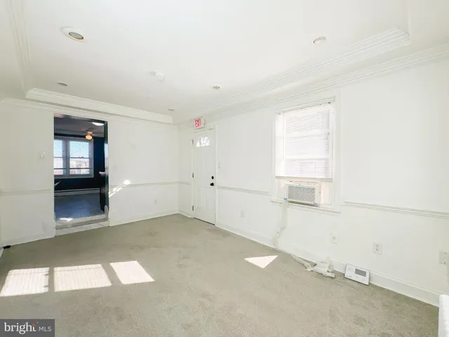 a view of storage and utility room with windows