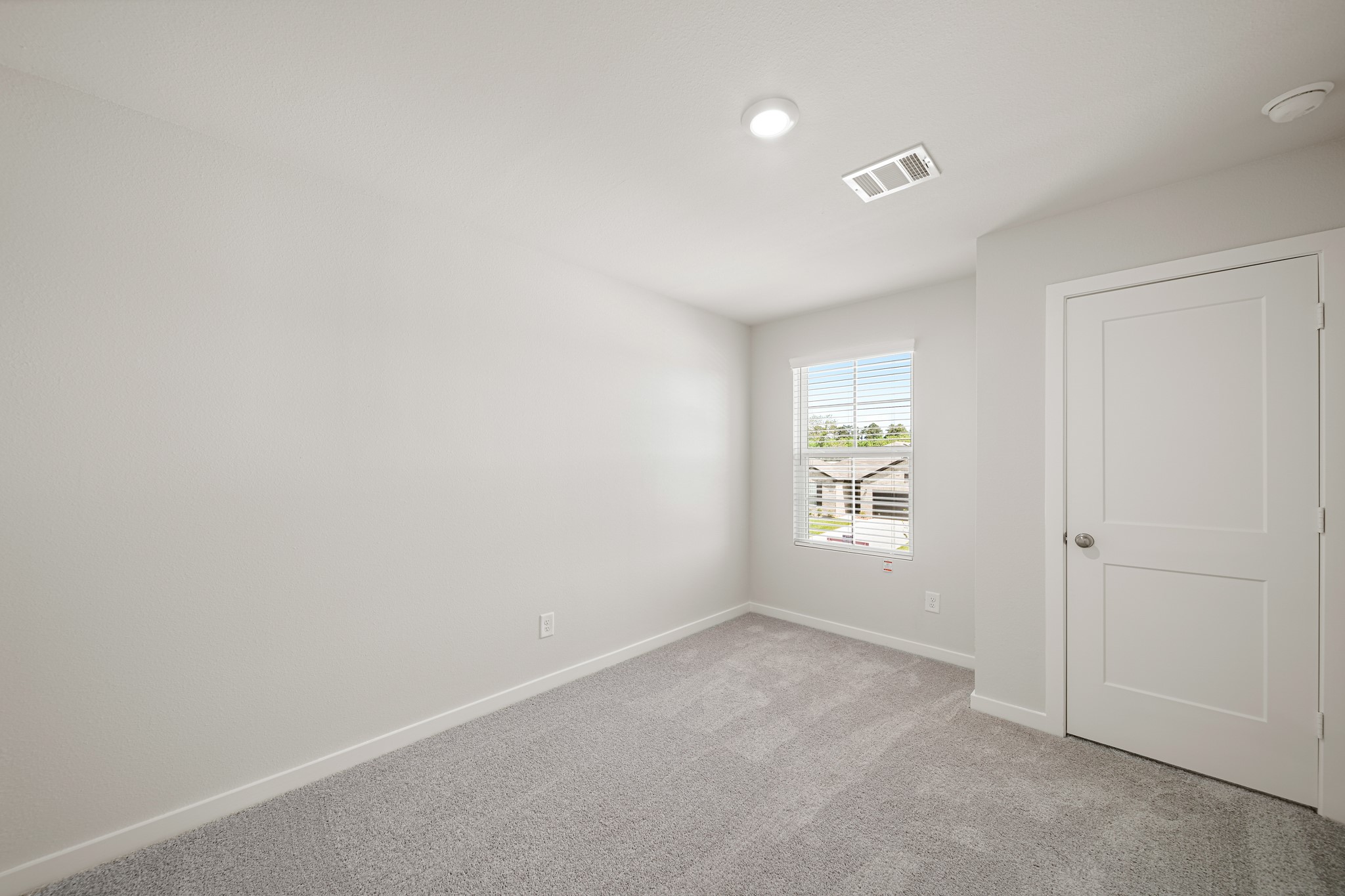 233 Spring Drive Hockley, TX 77447 - Photo 17 of 24 an empty room with windows