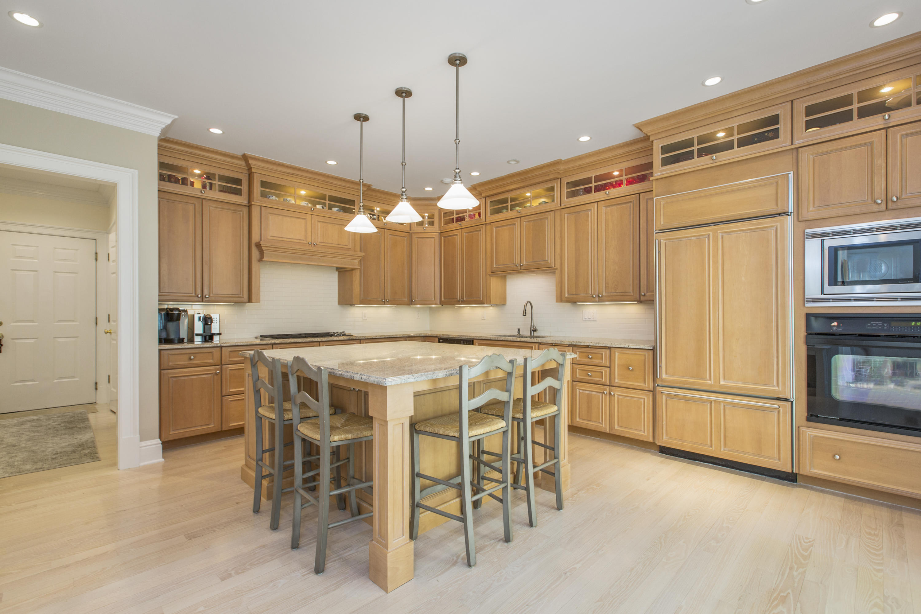 30 Richmond Hill Road, Unit 4 New Canaan, CT 06840 - Photo 13 of 40 a kitchen with kitchen island a center island a stove and a refrigerator