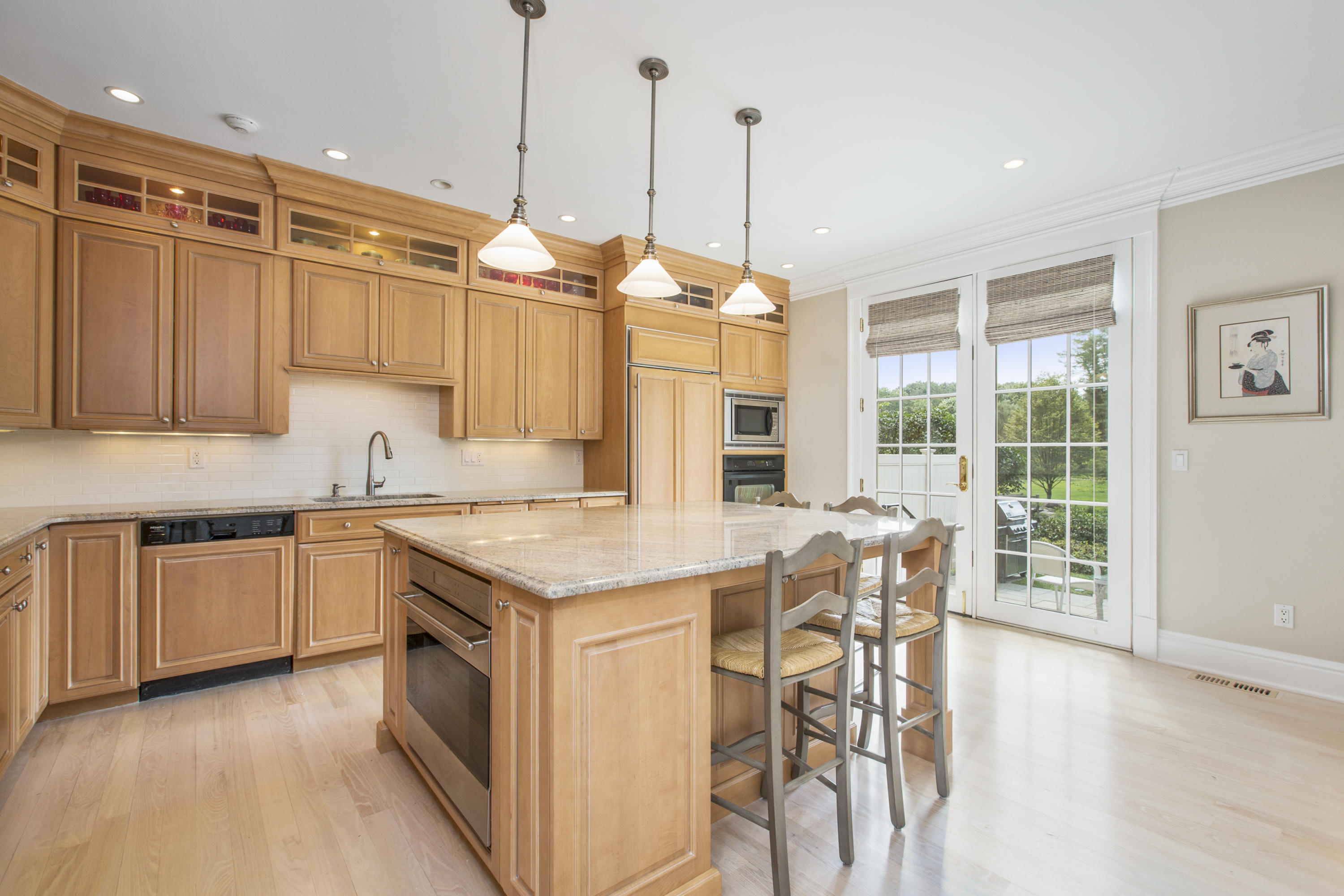 30 Richmond Hill Road, Unit 4 New Canaan, CT 06840 - Photo 14 of 40 a kitchen with stainless steel appliances granite countertop a stove and a wooden floors