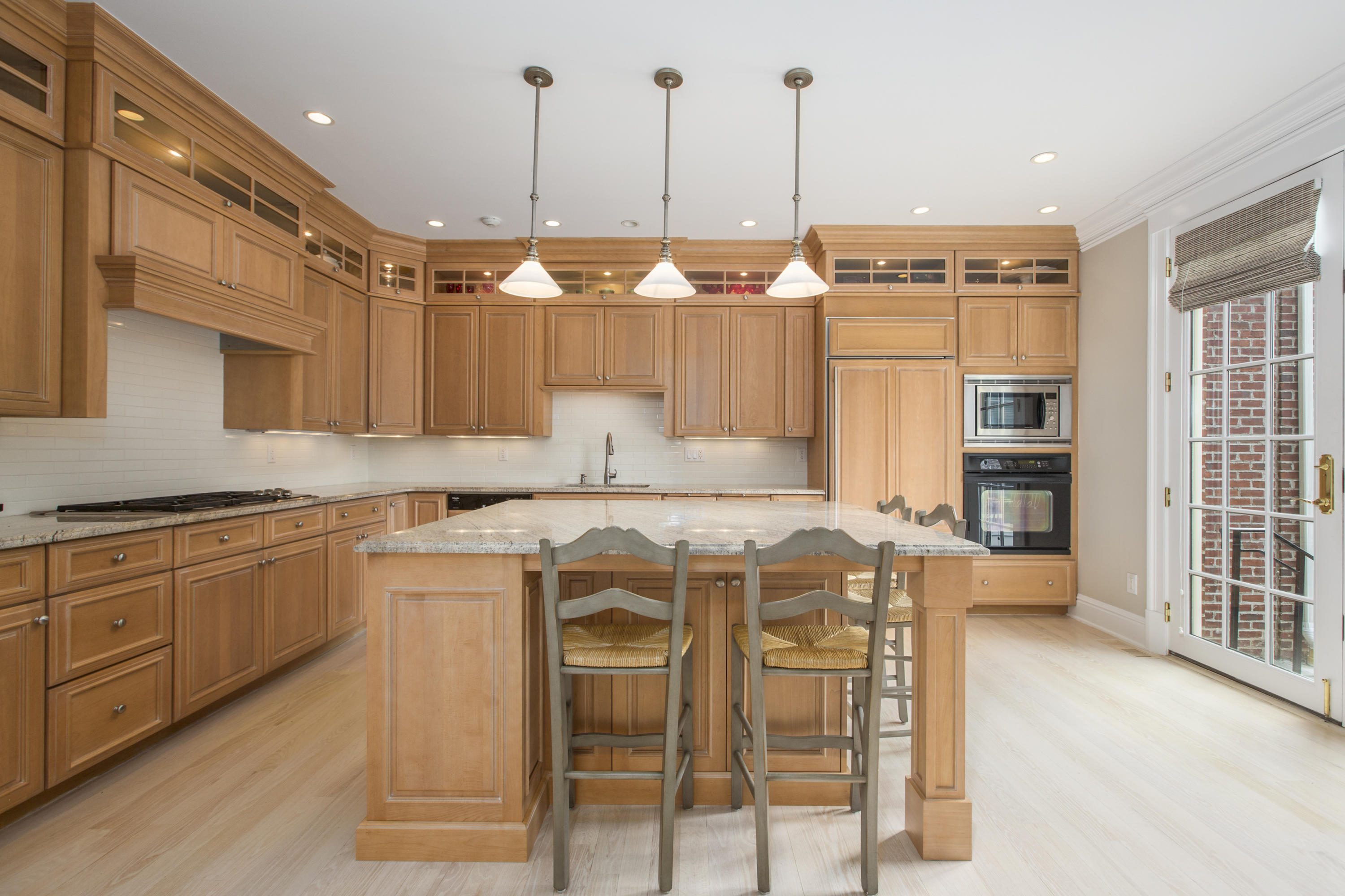 30 Richmond Hill Road, Unit 4 New Canaan, CT 06840 - Photo 15 of 40 a kitchen with a table chairs stove and cabinets