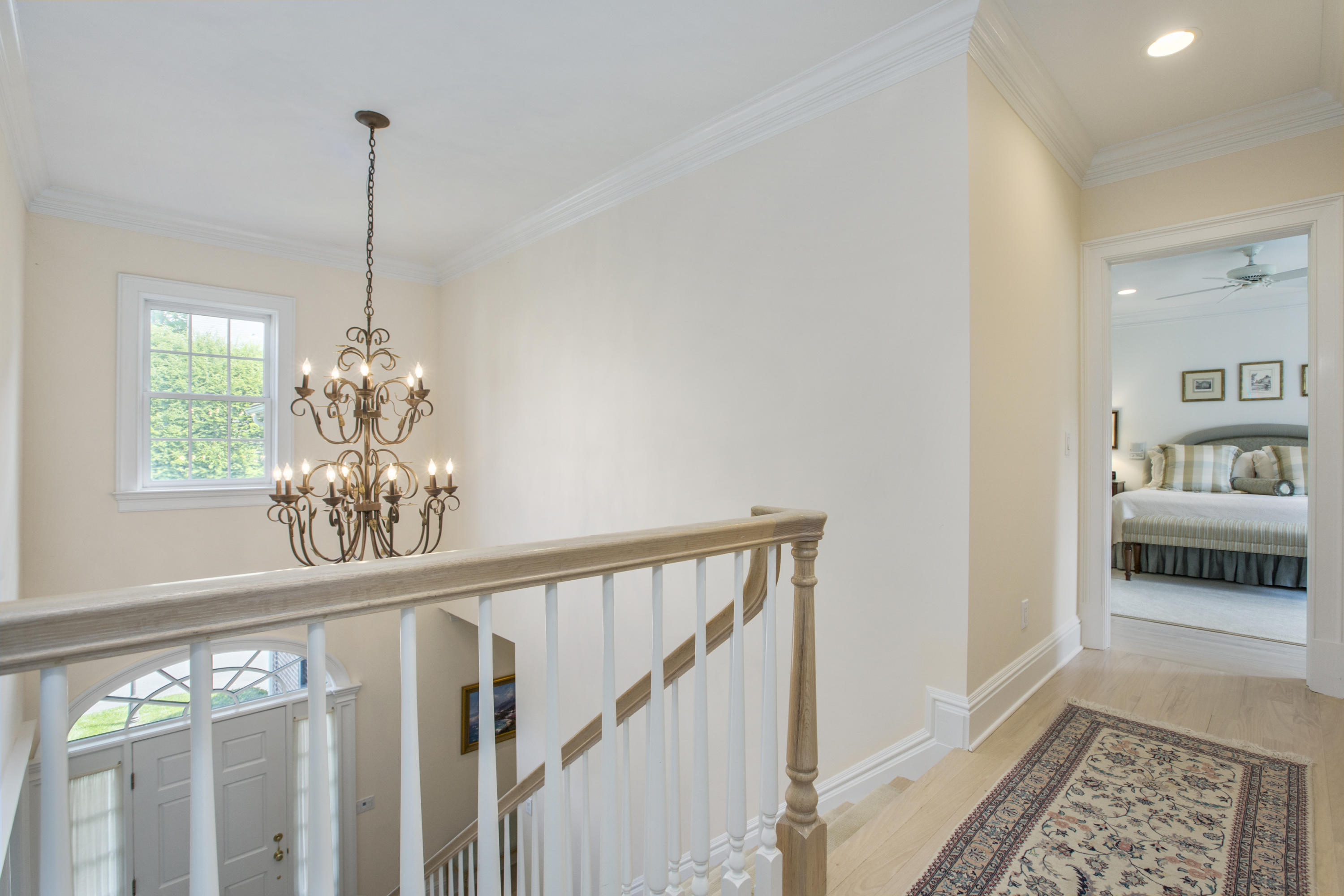30 Richmond Hill Road, Unit 4 New Canaan, CT 06840 - Photo 19 of 40 a view of a hallway to room with wooden floor