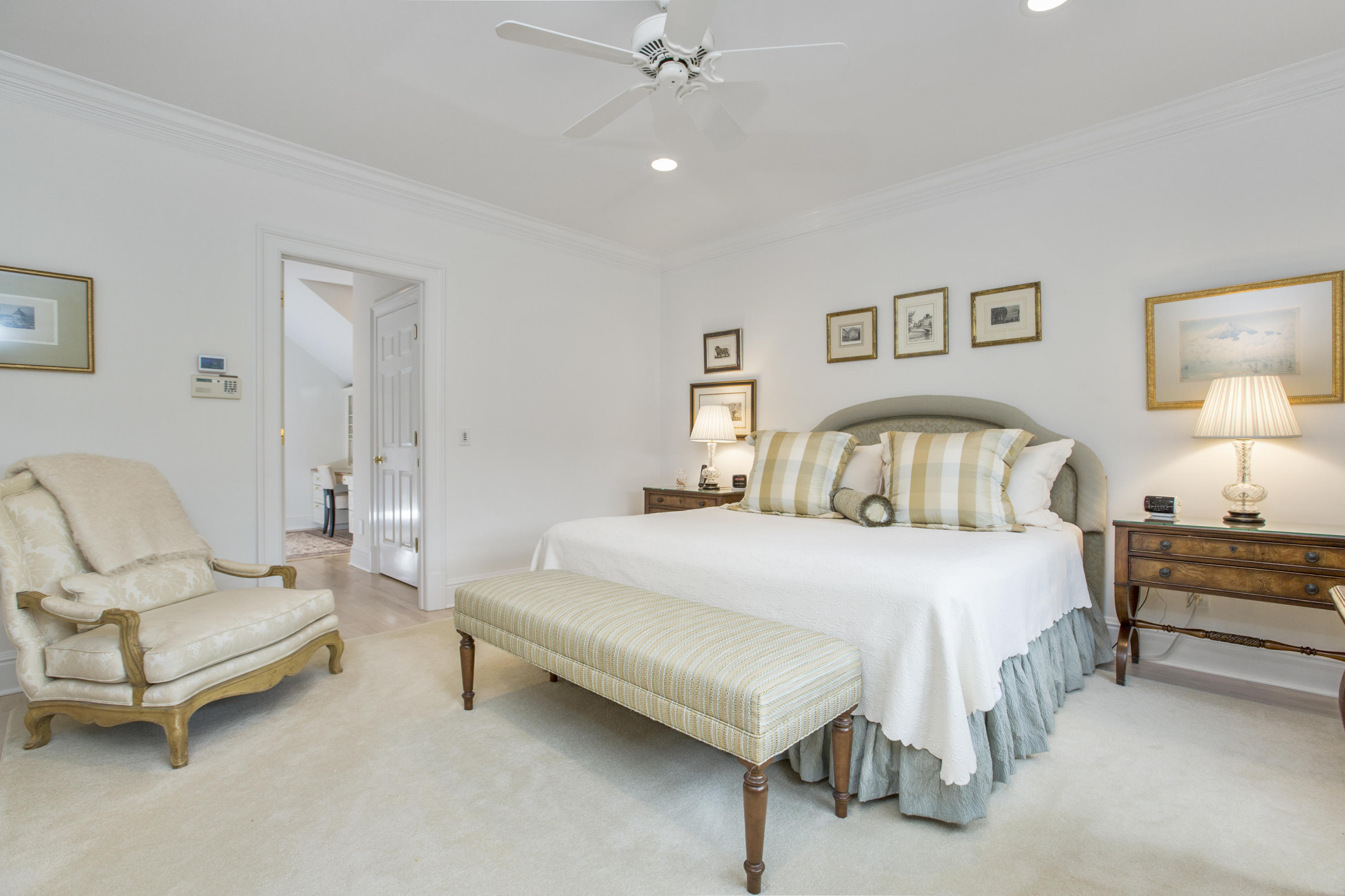 30 Richmond Hill Road, Unit 4 New Canaan, CT 06840 - Photo 20 of 40 a spacious bedroom with a bed and a couch