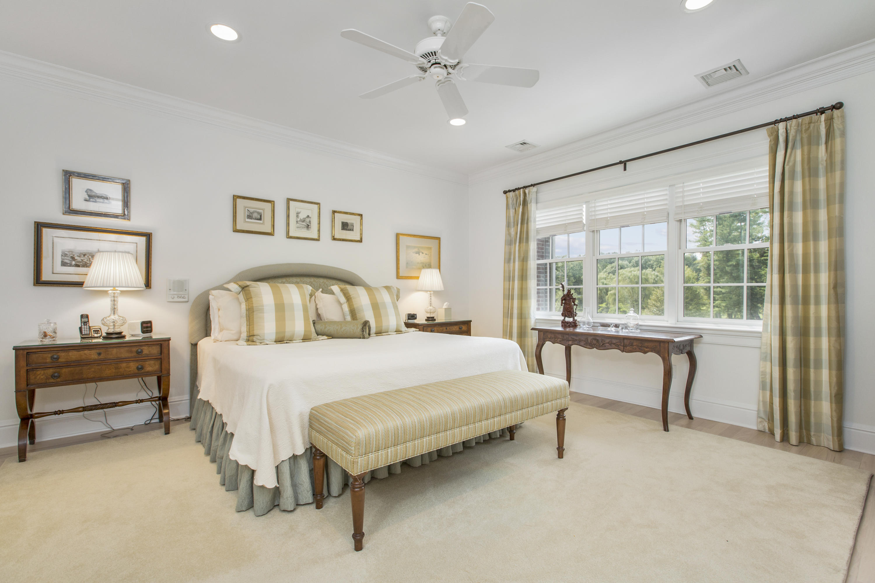 30 Richmond Hill Road, Unit 4 New Canaan, CT 06840 - Photo 21 of 40 a spacious bedroom with a bed and a table