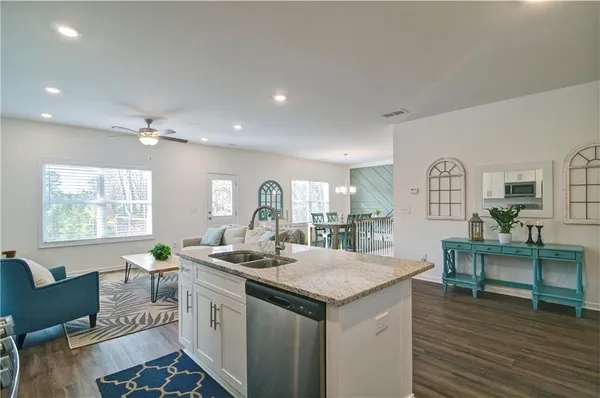 a view of living room with granite countertop furniture and fireplace