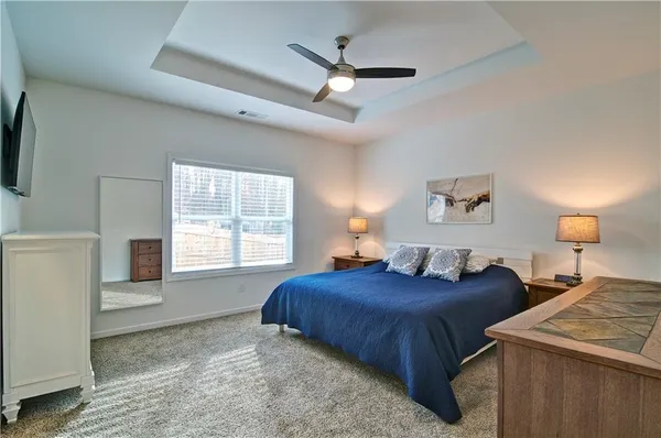 a bedroom with double bed and a window