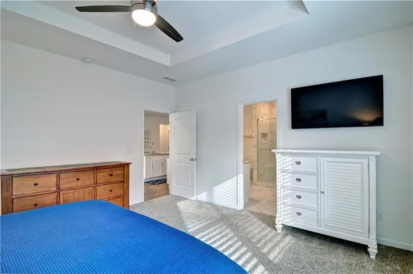 a view of living room with cabinets and flat screen tv
