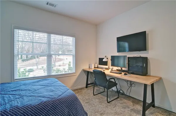 a workspace with furniture and a fireplace