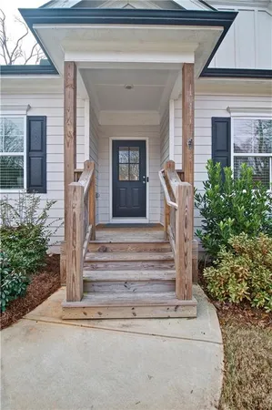 a front view of a house with a porch