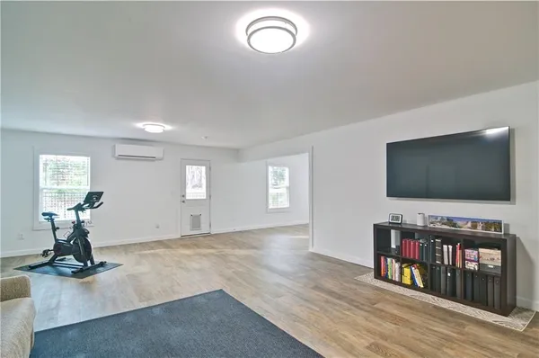 a workspace with furniture hardwood and a window