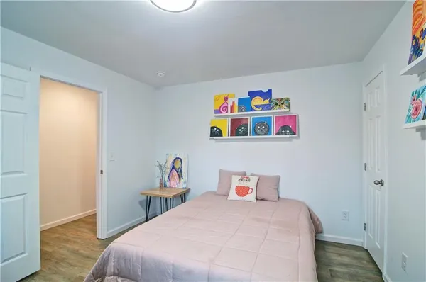 a view of balcony with wooden floor and fence