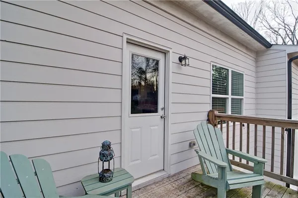 a view of a house with backyard and trees