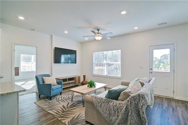 a living room with furniture and a window